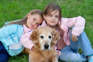Two young girl and dog