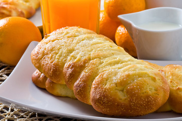 Breakfast with croissants in white dish.