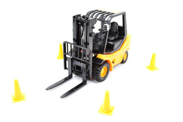 Forklift Truck Driving Around Cones