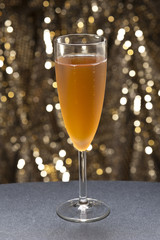 Champaign glass in front of glitter background