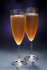 Champaign glass in front of blue purple background