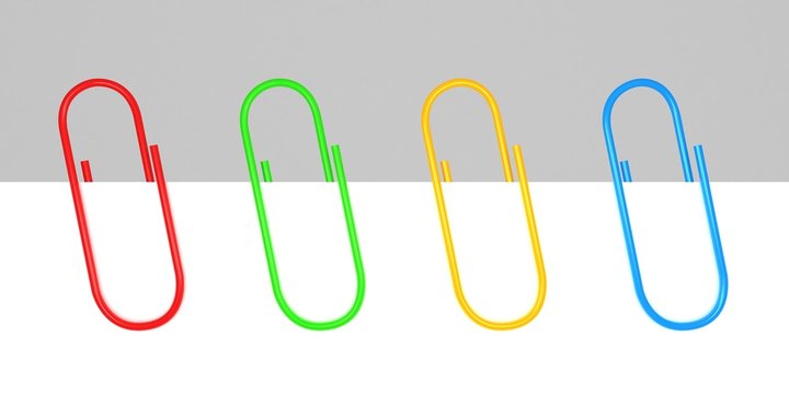 colored office paper clips on white blank