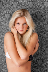 Fototapeta na wymiar Sweet blond model in white bikini