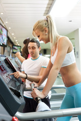 Personal training helping client