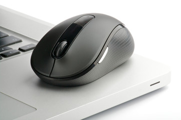 Steel laptop and black computer mouse