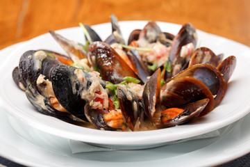 bowl with cooked mussels