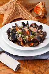 bowl with cooked mussels