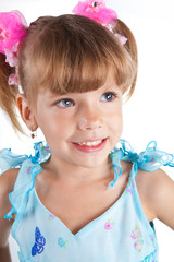 Portrait of a cute little girl in blue dress