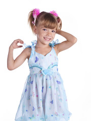 Portrait of a cute little girl in blue dress