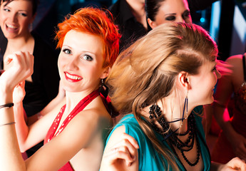 Women in club or disco dancing © Kzenon