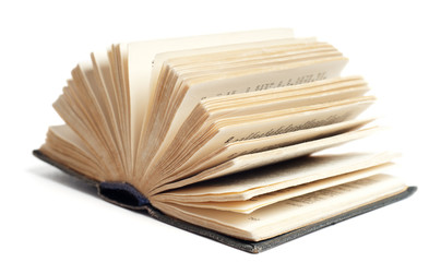 Opened old book isolated on white