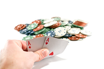 Male hand showing two aces