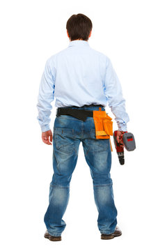 Portrait Of Construction Worker Standing Back To Camera