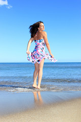 Fototapeta na wymiar Photograph of a beautiful woman on the beach