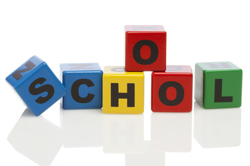 SCHOOL spelled with alphabet building blocks