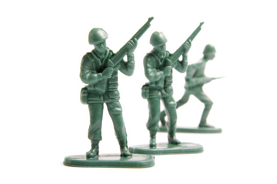 Three toy soldiers on a white background