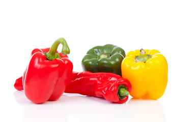 Various paprika over white background