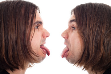 Profile of man face sticking out tongue