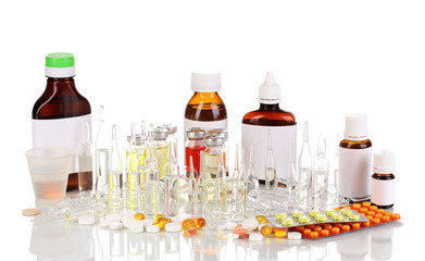 Medical bottles with medical ampoules and tablets isolated