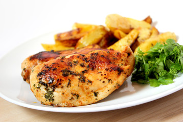 roast chicken with baked potatoes and green