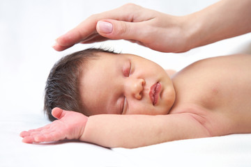 Baby and Mothers hand