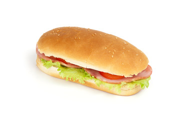 Long sandwich with ham, swiss cheese, lettuce and tomatoes