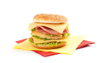 Big appetizing sandwich with lettuce, ham and cheese