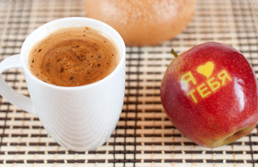 Coffee and apple with the inscription 