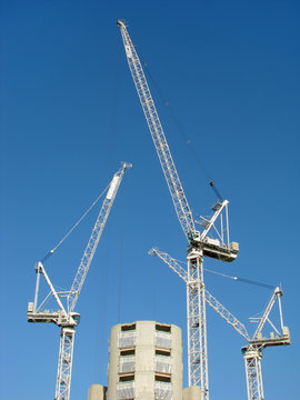 tower cranes in blue sky
