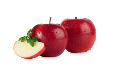Red apples with drops and a slice