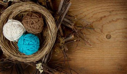 Balls of yarn in a nest