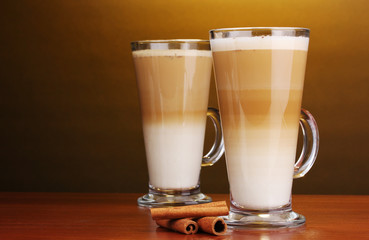 Fragrant сoffee latte in glass cups and cinnamon