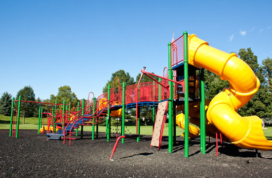 Complex playground set in well-maintained park