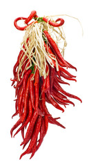 String of red hot peppers drying