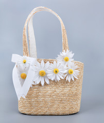 Fototapeta na wymiar Straw beach bag with flowers