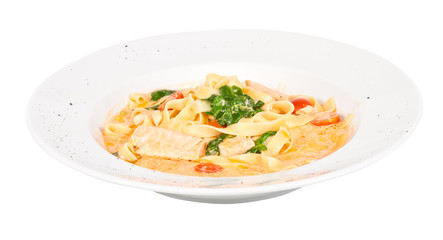 tasty pasta with cream, salmon, cheese and parsley close up