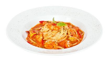 A plate of linguini with sauteed shrimp, tomato, chili  and oliv
