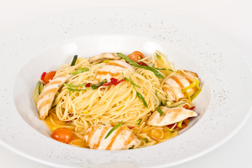 close-up of plate of pasta and chicken