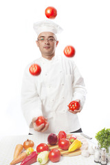 Cook juggles vegetables