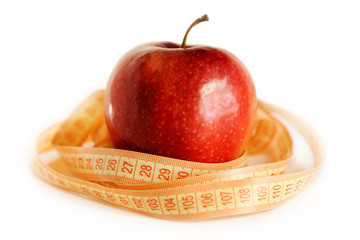 Red apple and tape measure