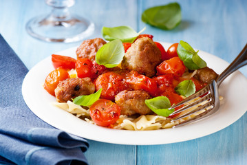 Farfalle pasta with meatballs and cherry tomatoes