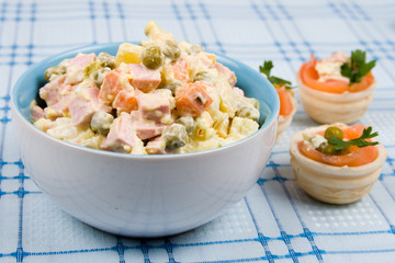 Russian traditional salad olivier with pea