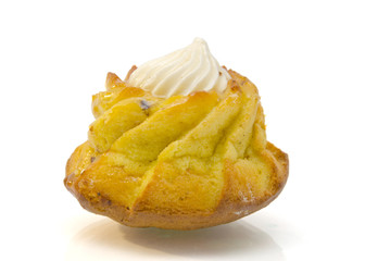 Cupcake with swirls of creamy frosting on white background