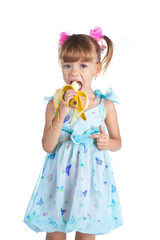 Pretty girl in a blue dress with a banana in her hands