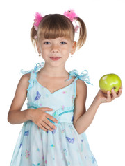 Pretty girl in a blue dress with an apple in her hand