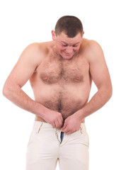 Naklejka premium A young man can not fasten little trousers