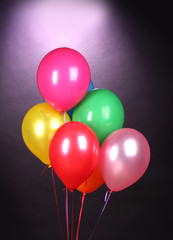 bright balloons on purole background