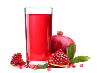 ripe pomergranate and glass of juice isolated on white.