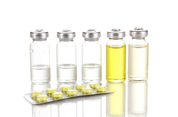 Tablets and ampoules isolated on white