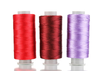 Three bobbin thread isolated on white